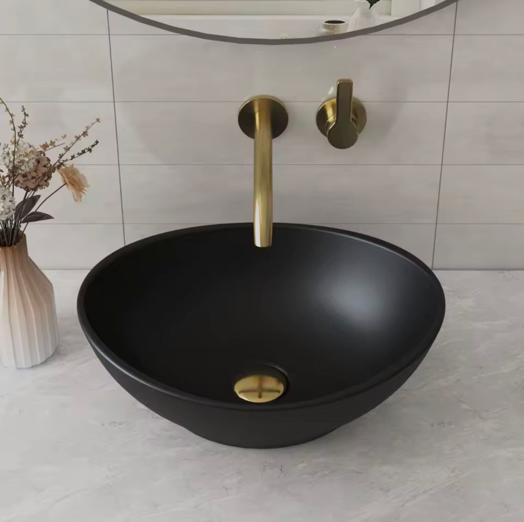 Lavabo Ovalado sobre Encimera de Cerámica Negra Artística
